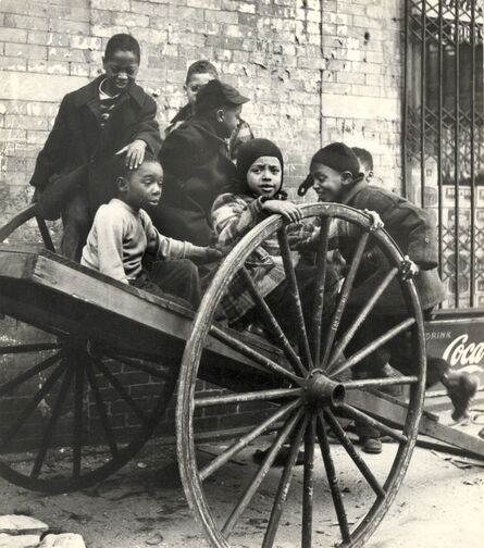 Leo Goldstein, ‘Group of Children Playing on Wooden Cart with Huge Wheels, New York City’, ca. 1950