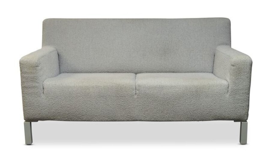a white upholstered two seater sofa, together with three matching lounge chairs