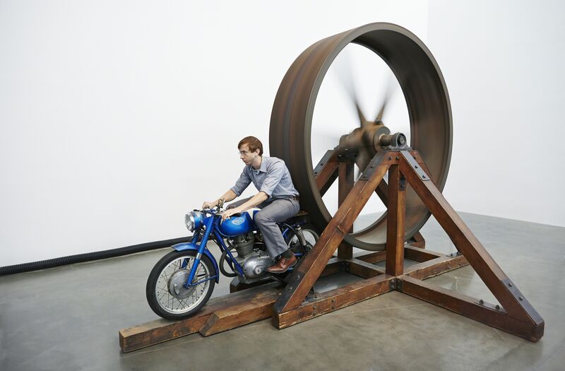 Chris Burden, ‘The Big Wheel. Installation view, “Chris Burden: Extreme Measures” at New Museum, New York, 2013’, 1979, Sculpture, Three-ton, eight-foot diameter, cast-iron flywheel powered by a 1968 Benelli 250cc motorcycle, New Museum