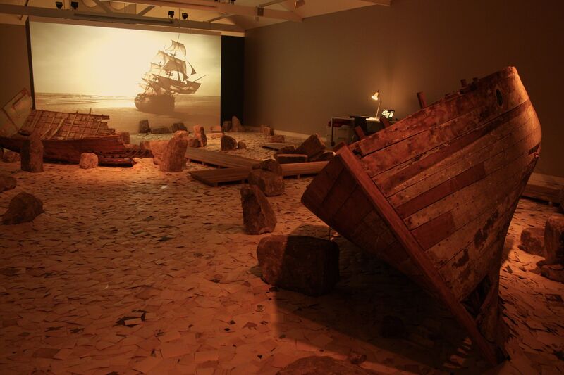 Dinh Q. Lê, ‘Erasure’, 2011, Installation, Single-channel color video with sound, found photographs, stone, wooden boat fragments, wood walkway, computer, scanner, dedicated website (erasurearchive.com), Mori Art Museum