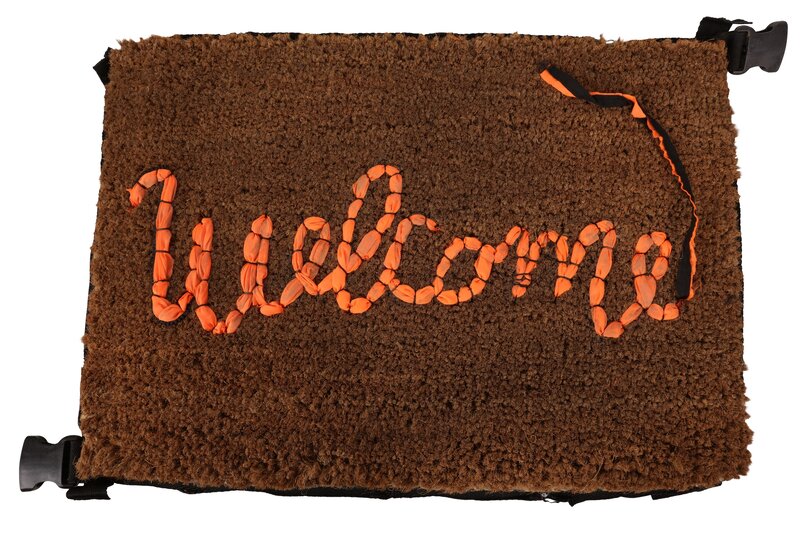 Banksy, ‘Welcome mat no. 70’, Ephemera or Merchandise, Hand stitched welcome mat, the lettering made from the salvaged fabric of migrants' life jackets abandoned on Mediterranean beaches numbered 70 (attached to a label stitched onto the reverse), Chiswick Auctions