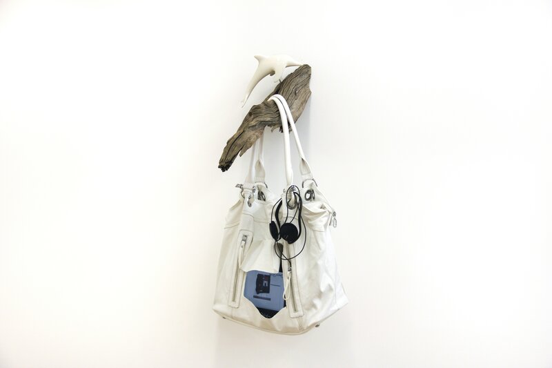 Georgia Sagri, ‘Video Bag / David Hammons Toy with Egypt and Libya’, 2011, Sculpture, Portable DVD player, DVD (David
Hammons Toy, 2010,  2 min, 49 sec),

headphones, leather bag on driftwood
with ceramic dolphin, Anthony Reynolds Gallery