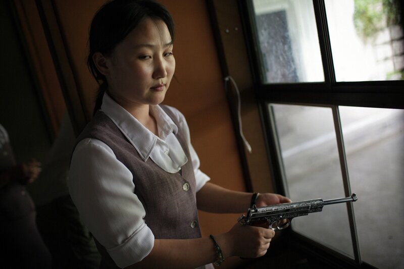Tomas van Houtryve, ‘A North Korean woman loads a pistol for firing practice in Pyongyang, North Korea’, 2007, Photography, Museum of Contemporary Photography (MoCP)