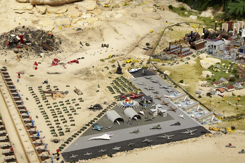 Chris Burden, ‘A Tale of Two Cities. Installation view, “Chris Burden: Extreme Measures” at New Museum, New York, 2013’, 1981, Installation, Two miniature cities with approx.. five thousand toys, sand, plants, boulders, New Museum
