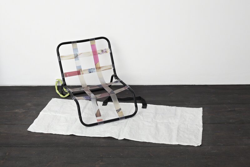 Aude Pariset, ‘'Hosted As Seen On Screen / Relags Travel Chair'’, 2012, Sculpture, Adhesive prints on PVC, beach seat, bicycle lock, metal ring, painted plastic cover, Sandy Brown