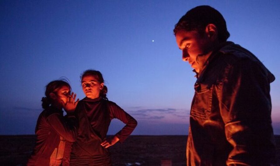Scenes of youth in a small refugee encampment in the desert of eastern Jordan after fleeing Syria, 2013