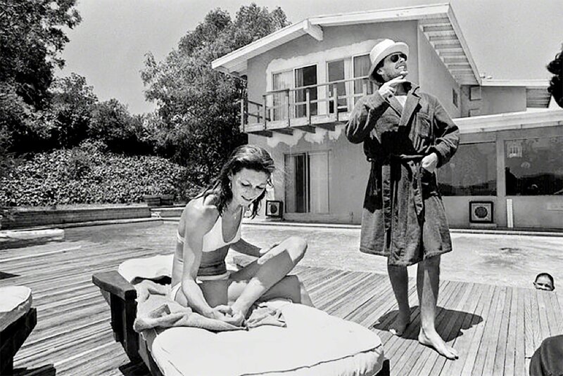 Julian Wasser, ‘Anjelica Huston and Jack Nicholson by the pool’, N/A, Photography, Silver Gelatin Print, Hilton Contemporary