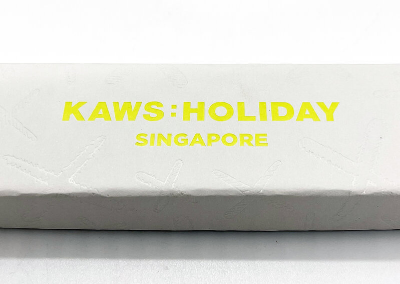 KAWS, ‘KAWS 'Singapore: Fan' (w/display)’, 2021, Ephemera or Merchandise, Collectible designer paper and bamboo sensu/fan engraved with KAWS:HOLIDAY and subtle "X" patterns on the paper. Includes custom clear acrylic display case with wood base, black suede platform and unique acrylic fan holder., Signari Gallery