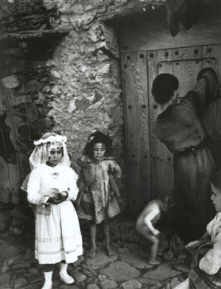 W. Eugene Smith, ‘Lorenza Curiel in White First Communion Dress Waiting for Her Mother to Lock Door (from 'Spanish Village')’, 1950-51/1970s