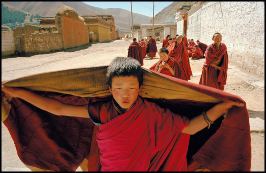 Novice Tibetan monks on their way to prayer. Xiahe, Gansu Province, China