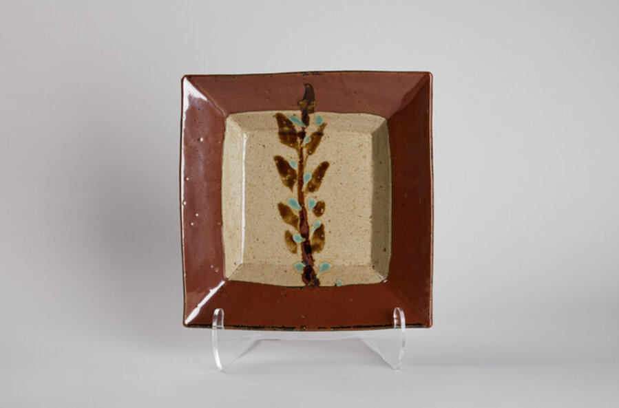 Square plate with design of grass in persimmon glaze