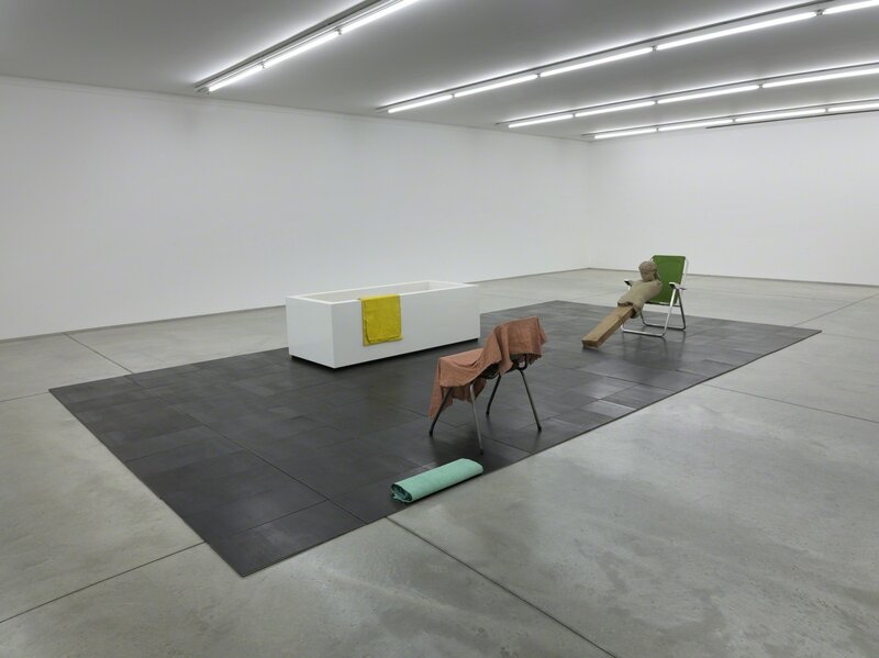 Mark Manders, ‘Isolated Bathroom / Composition with Four Colors’, 2010-2014, Installation, Iron, aluminium, painted aluminium, painted canvas, painted epoxy, wood, offset print on paper  (Used words: Yellow, Pink, Green, Blue, Bathroom, Bathtub, Towel, Clay, Figure, Beam, Floor and Chair), Collezione Maramotti