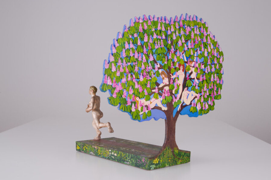 Woman running from flowering chestnut tree
