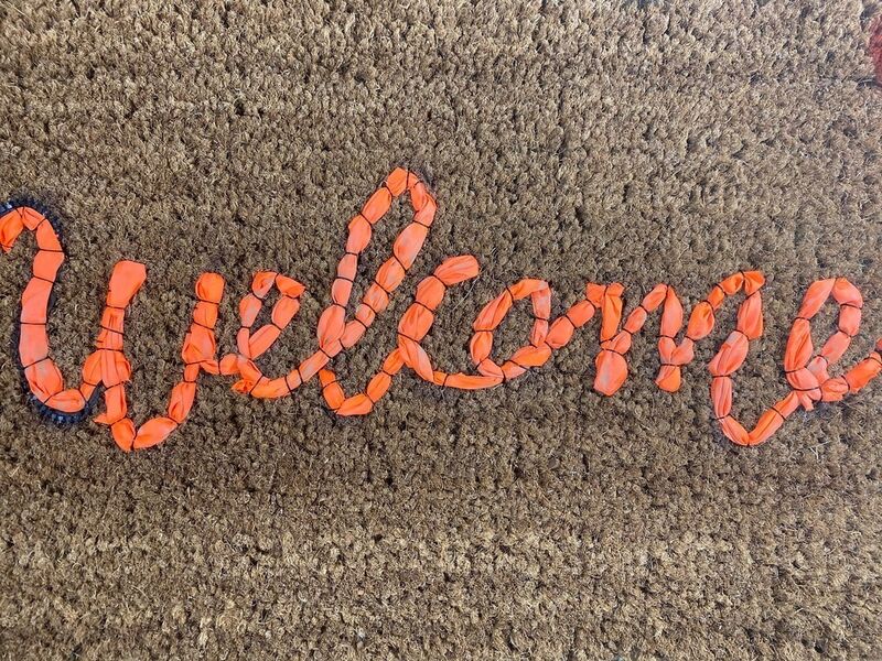 Banksy, ‘Love Welcomes’, 2019, Ephemera or Merchandise, Life vest fabric on fiber doormat, Artsy x Capsule Auctions