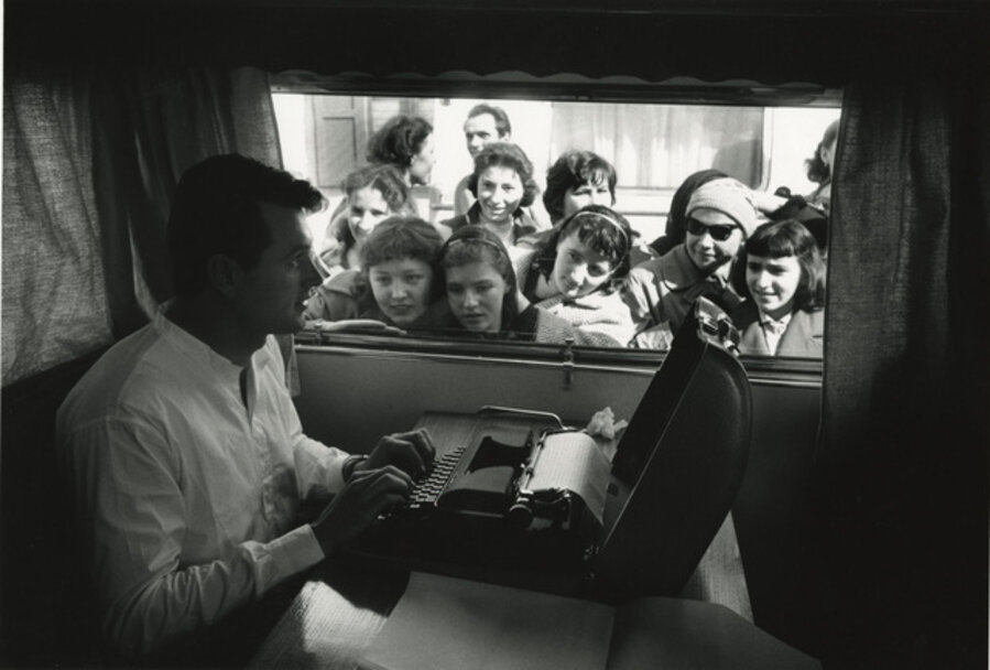Rock Hudson trying to type in his trailer, but the fans are a bit distracting, on location in Italy for "Farewell To Arms"