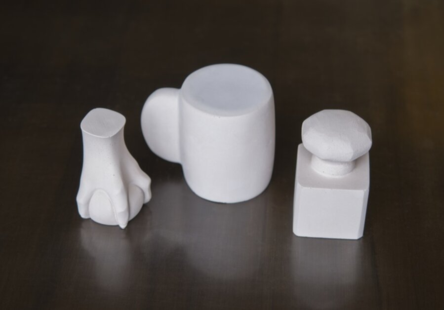 Three Paperweights (Mug, Knob, Claw)