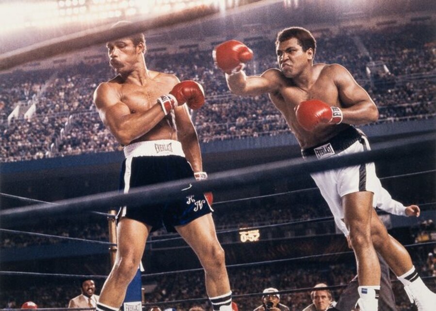 Muhammad Ali throwing a right hook to Ken Norton during the WBC/ WBA World Heavyweight Title fight at Yankee Stadium, The Bronx, New York