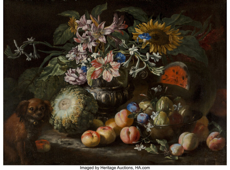 A still life of fruit and flowers in a footed gadrooned silver vase with a spaniel looking on