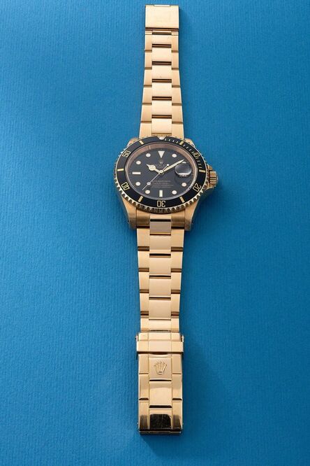 Rolex, ‘A fine and attractive yellow gold diver’s wristwatch with date, sweep center seconds, bracelet, guarantee, hang tag and box’, Circa 1991