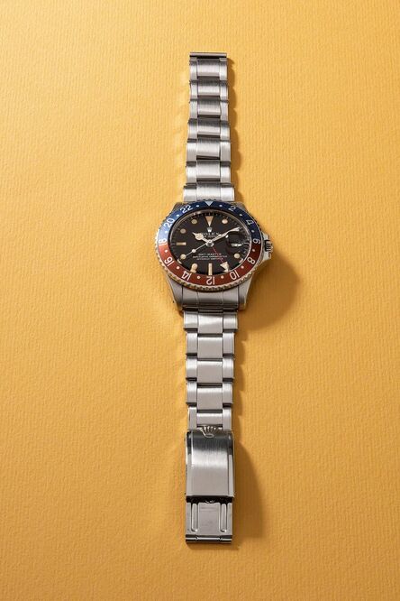 Rolex, ‘A rare and attractive stainless steel dual-time wristwatch with gilt lacquered dial, date, sweep center seconds, box and guarantee’, Circa 1966