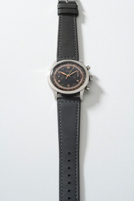 Cyman, ‘A very rare stainless steel chronograph wristwatch with glossy black dial, telemeter and tachymeter scales’, Circa 1950s