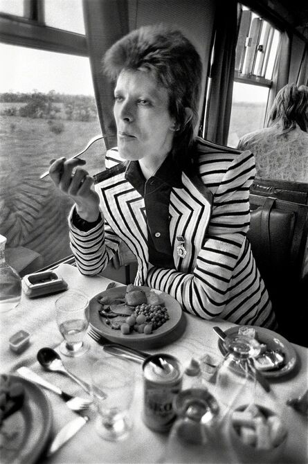 Mick Rock, ‘Bowie Eating on Train’, 1973