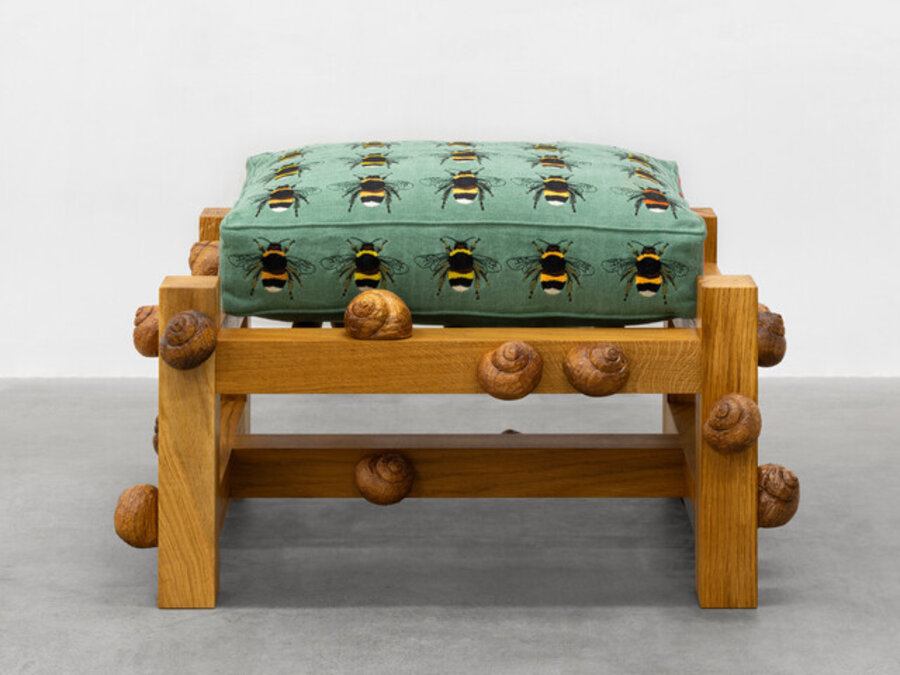 Oak bench with bumble bees, poppy flowers and snails