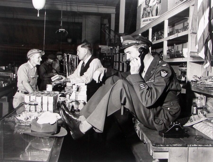 Jimmy Stewart Talking Behind Counter at His Father's Hardware Store While His Father Chats with Customer upon Stewar's Return from WWII, Indiana, PA