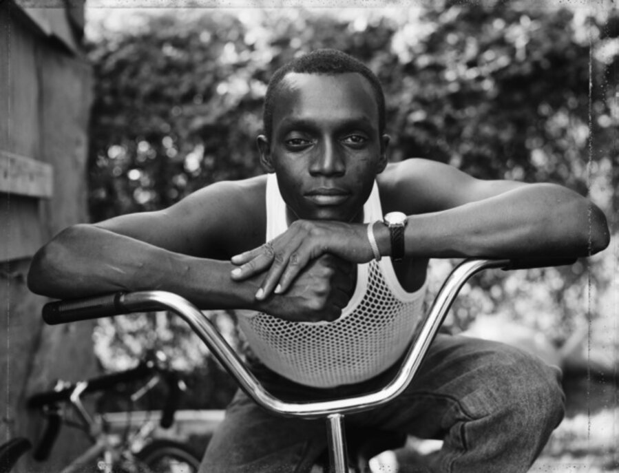 A Young Man Resting on an Exercise Bike, Amityville, NY