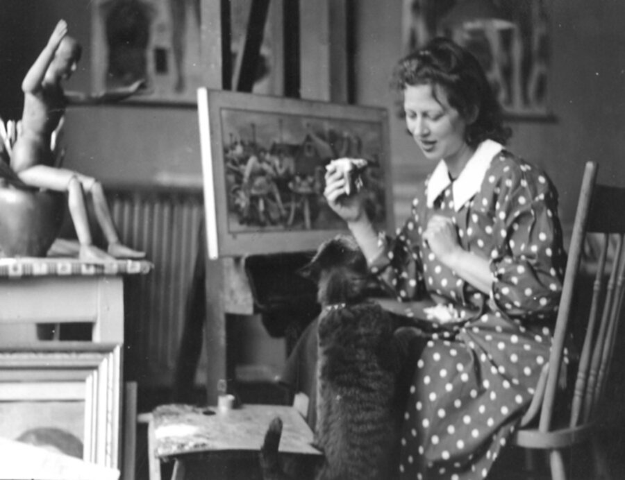 Doris Lee in studio feeding cat portrait