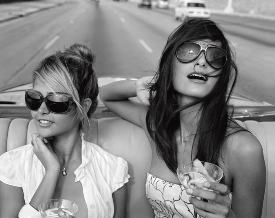 Giselle Karina Bacallao Moreno and Rachel Valdes going for a spin on the Malecon, Habana, Cuba