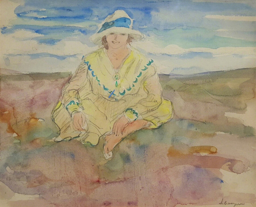 Jeune fille assise sur la plage