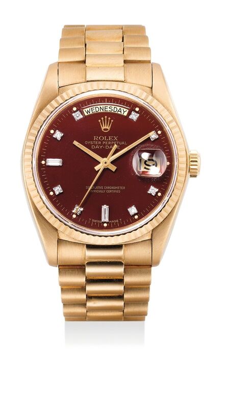 Rolex, ‘A very fine and rare yellow gold and diamond-set wristwatch with day, date, sweep center seconds and burgundy "Stella" dial’, Circa 1979