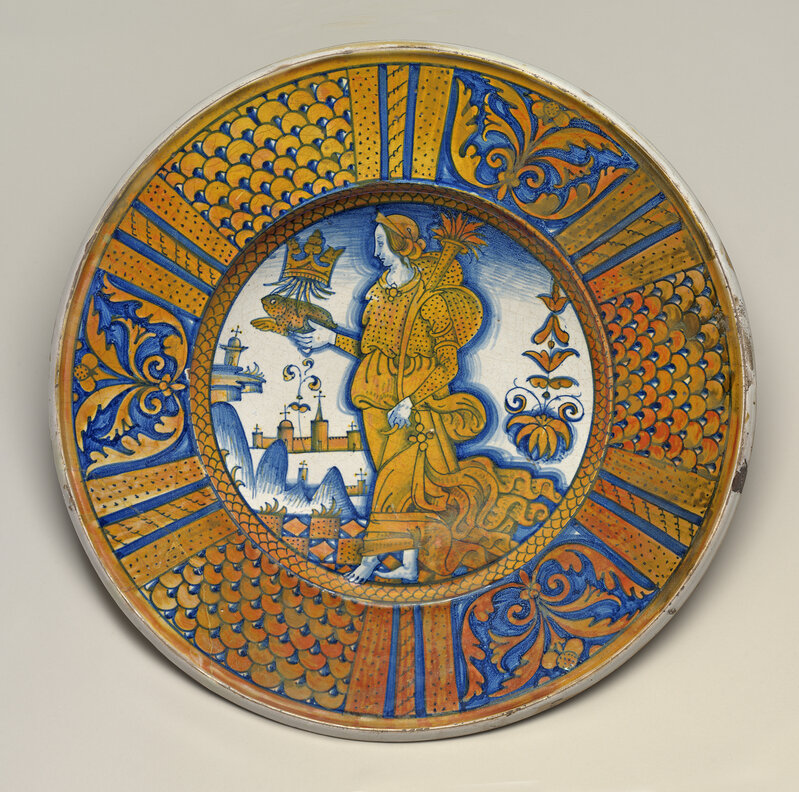 ‘Large dish with segmental border of plant sprays and scale pattern; in the center, an emblematic female figure holding a crowned toad and cornucopia’, ca. 1510/1540, Design/Decorative Art, Tin-glazed earthenware (maiolica), National Gallery of Art, Washington, D.C.