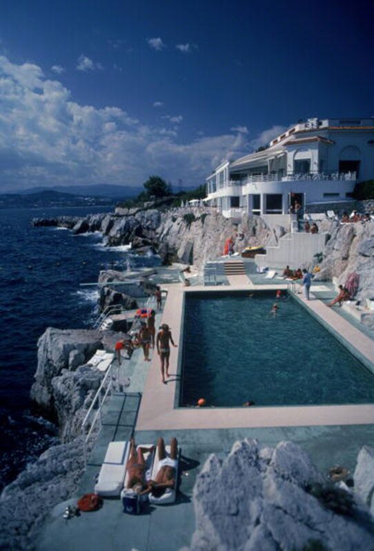 Slim Aarons, ‘Eden Roc Pool: Guests by the pool at the Hotel du Cap Eden-Roc, Antibes, France’, 1976, Photography, C-Print, Staley-Wise Gallery