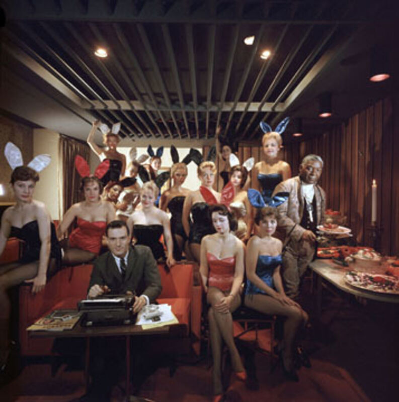 Slim Aarons, ‘Man's Work, 1960: Hugh Hefner and Bunnies at the Playboy Key Club, Chicago’, 1960, Photography, C-Print, Staley-Wise Gallery