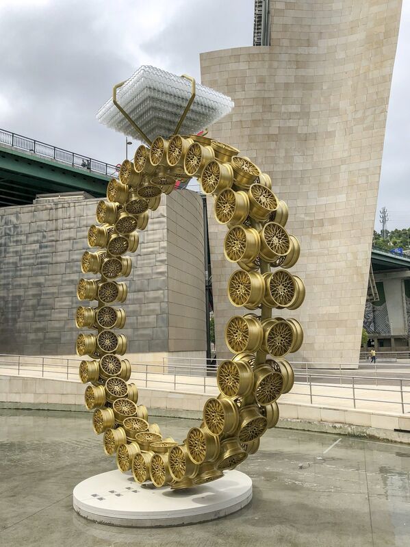 Joana Vasconcelos, ‘Solitaire (Solitário)’, 2018, Reproduction, 18'' light alloy golden wheel rims, crystal whisky glasses, metallized and thermo-lacquered iron, stainless steel, tempered and laminated glass, Guggenheim Museum Bilbao