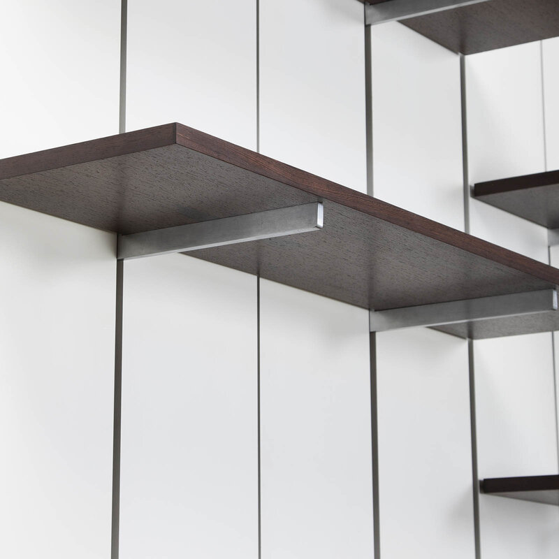 Preben Fabricius and Jørgen Kastholm, ‘Wall mounted shelving system’, 1960's, Design/Decorative Art, Black lacquered steel with wooden grey lacquered back panels, adjustable shelves and cases in wengé mounted on stainless steel brackets. Sliding doors in brushed aluminium, Dansk Møbelkunst Gallery