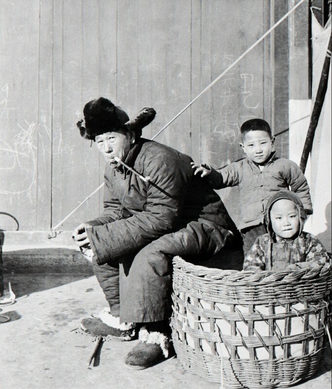 Hedda Morrison, ‘Man and children enjoying the winter sunshine’, ca. 1940, Photography, Powerhouse Museum