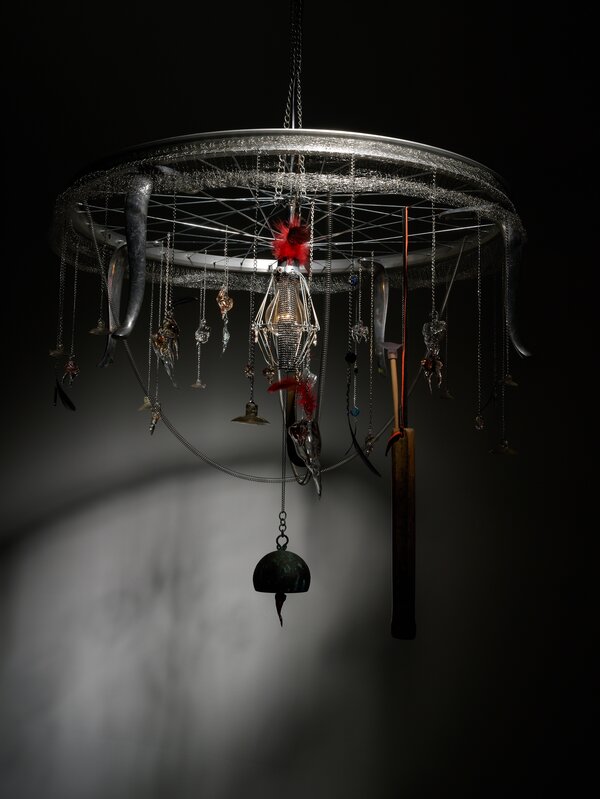 Yoo La Shin, ‘Afflicted Teeth Chandelier-General Yushin’, Mixed Media, Bicycle wheel, metal mesh, feather, wooden quiver, band, rubber tip, bronze bell, copper shoehorn, glass, crystal, beads, metal chain, light bult, Gallery Absinthe