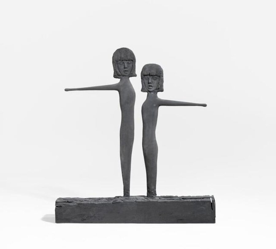 Two Wooden Girls with Yellow Drumsticks