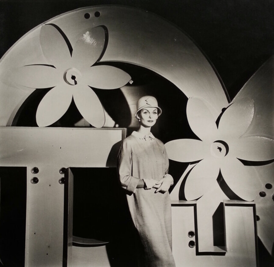 Anne St. Marie with flowers behind her, Harper's Bazaar
