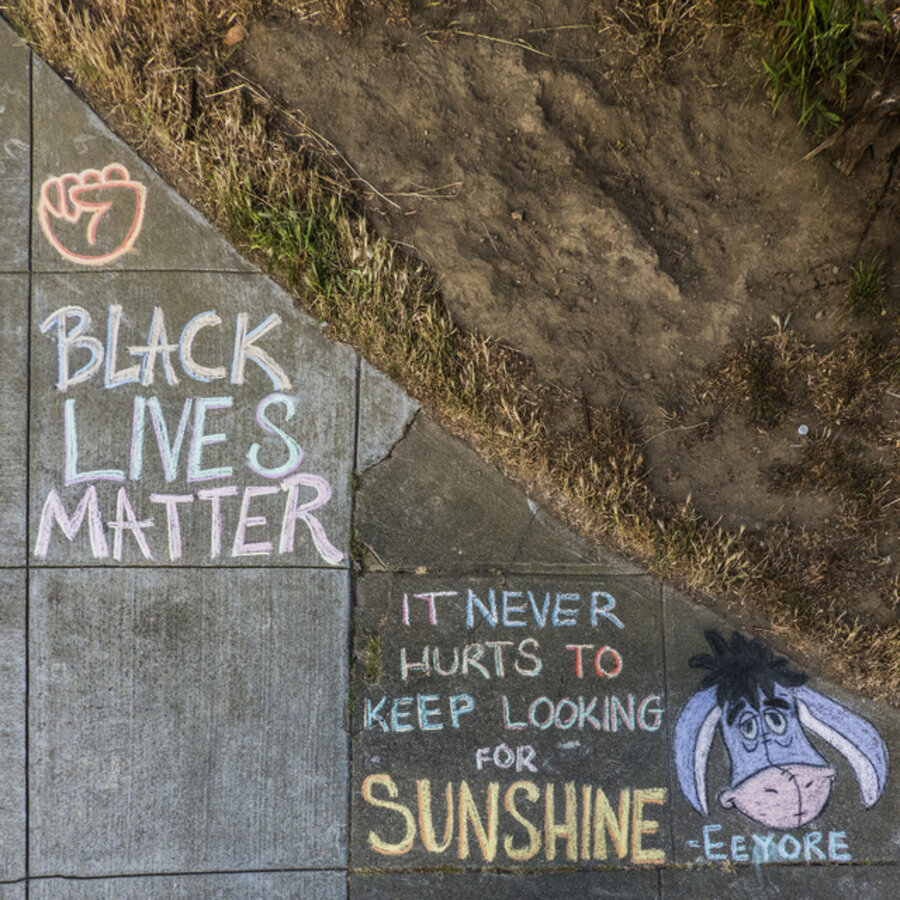 A chalk drawn “BLACK LIVES MATTER” optimistic sentiment, on Cabrillo Street, in Richmond district of San Francisco