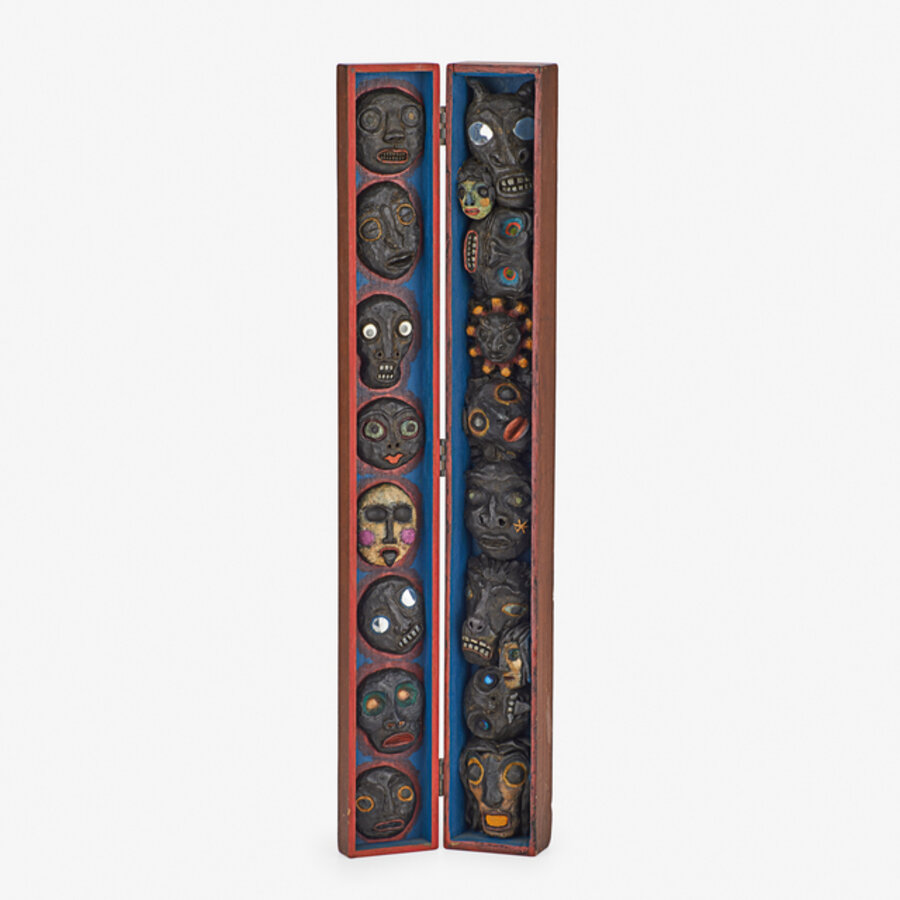 Reliefs of Faces Mounted on Board