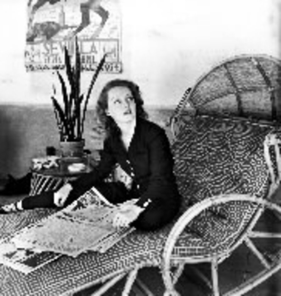 Actress Bette Davis Skimming Through the Morning Papers in her Playroom at Home, Hollywood, California