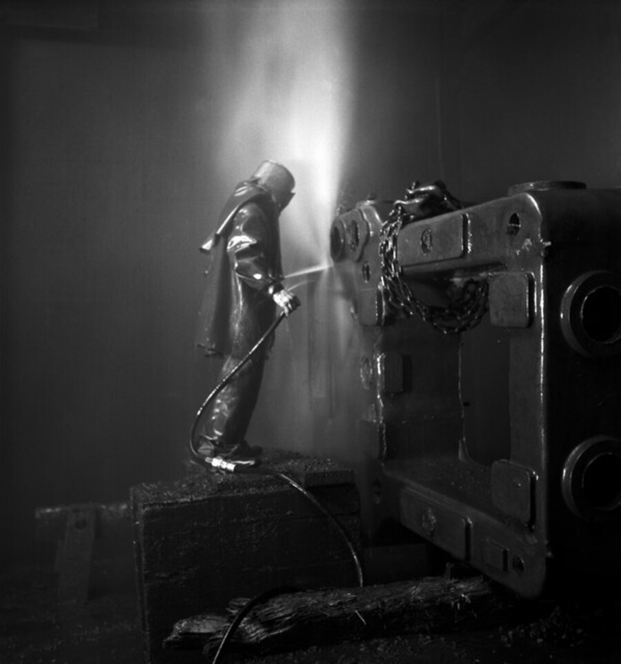 Worker at a machine. Winterthur, Switzerland