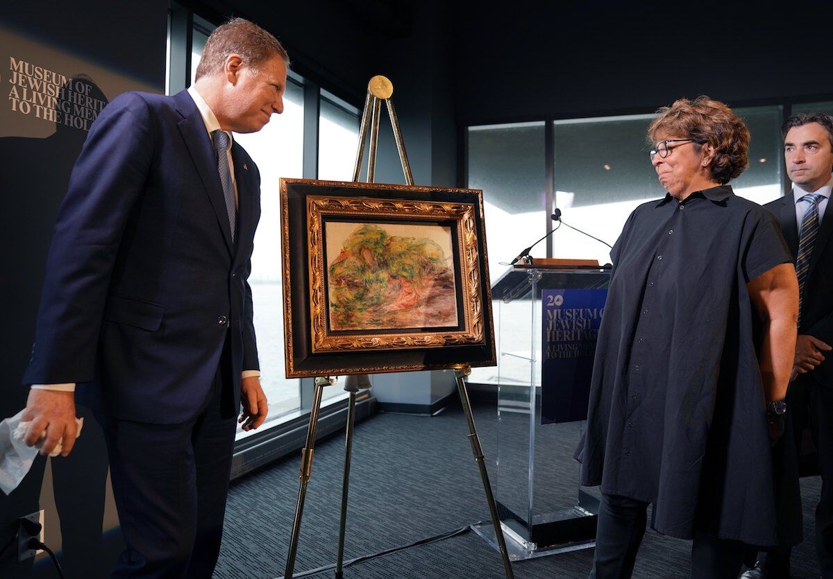 A Pierre Auguste Renoir painting,'Femmes dans un jardin, stolen by the Nazis was returned to the heir of its rightful owner, Sylvie Sulitzer, during a ceremony at the Museum of Jewish Heritage in New York on September 12, 2018. Photo by Timothy A. Clary/AFP/Getty Images)