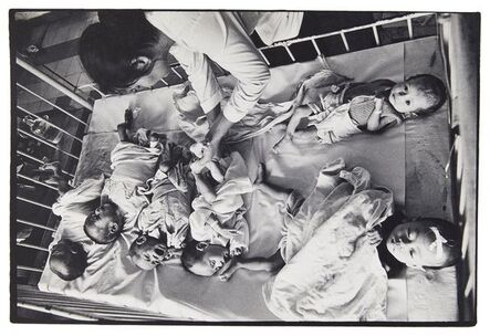 Philip Jones Griffiths, ‘Orphans from the Vietnamese war in a hospital cot’, c.1968