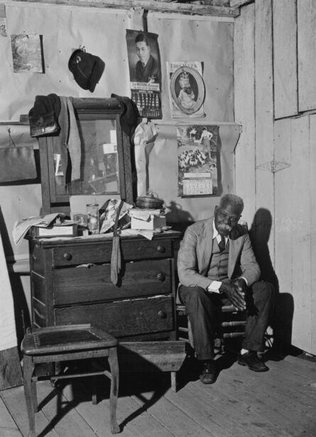 Jack Delano, ‘Untitled (Man seated next to his dresser)’, 1940