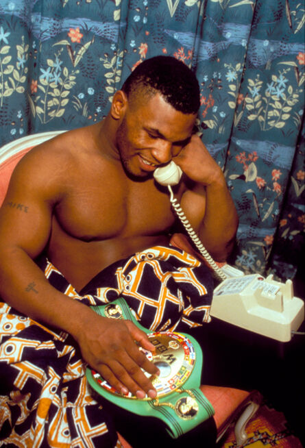 Lori Grinker, ‘Untitled (Phone Call) [Mike Tyson speaking with Camille Ewald after winning his first title, WBC World Championship, Las Vegas, 1986]’, 1986